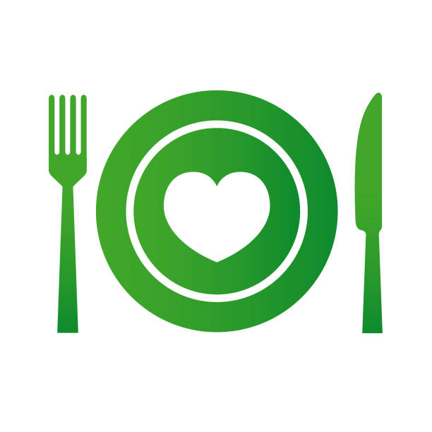 fork and knife on either side of a plate with a heart in the center